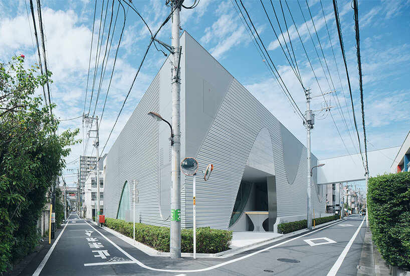 organic openings cut angular learning center in tokyo 