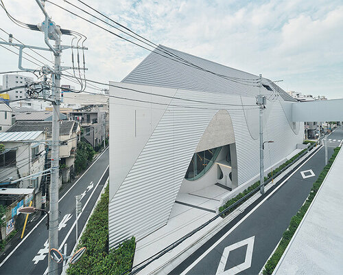 organic openings cut angular learning center in tokyo