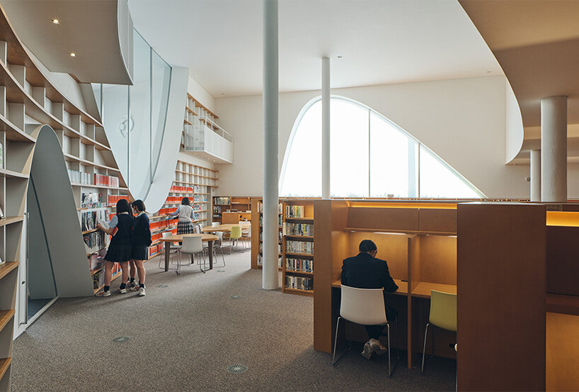 organic openings cut angular learning center in tokyo 