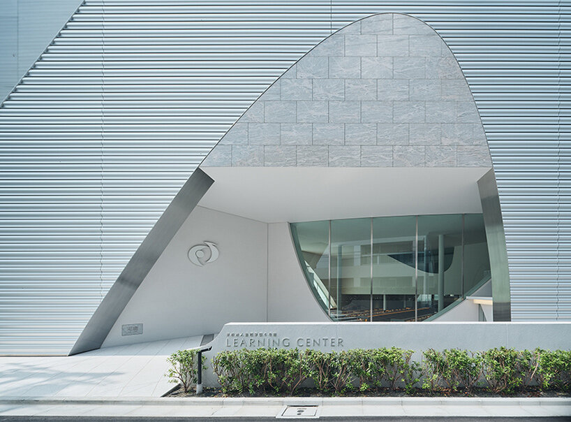 organic openings cut angular learning center in tokyo 