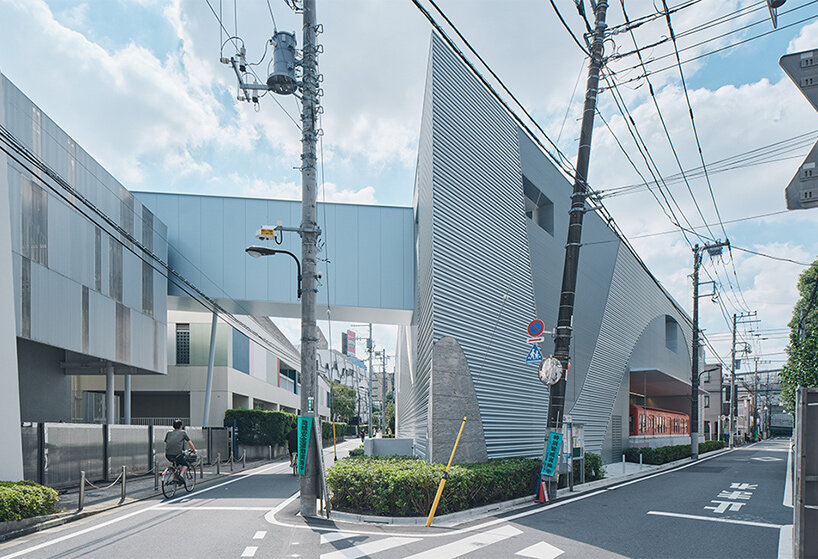 organic openings cut angular learning center in tokyo 