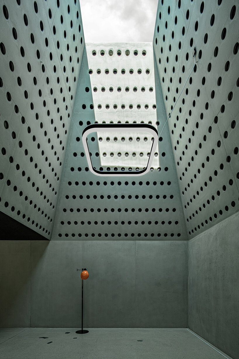 pedevilla inserts inner courtyards & dome-like skylights into workplace renovation in italy