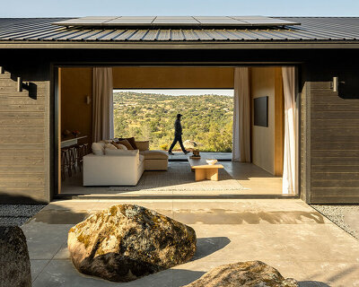 PPAA's hole-cut casa roca frames scenic views of wilderness in yosemite lakes, california