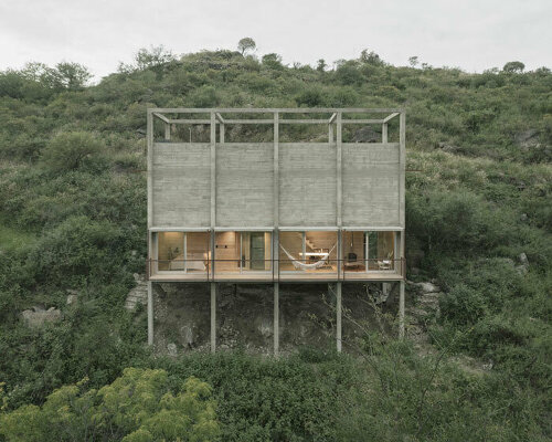 concrete 'casa taller' rises from the treetops of la paisanita, argentina