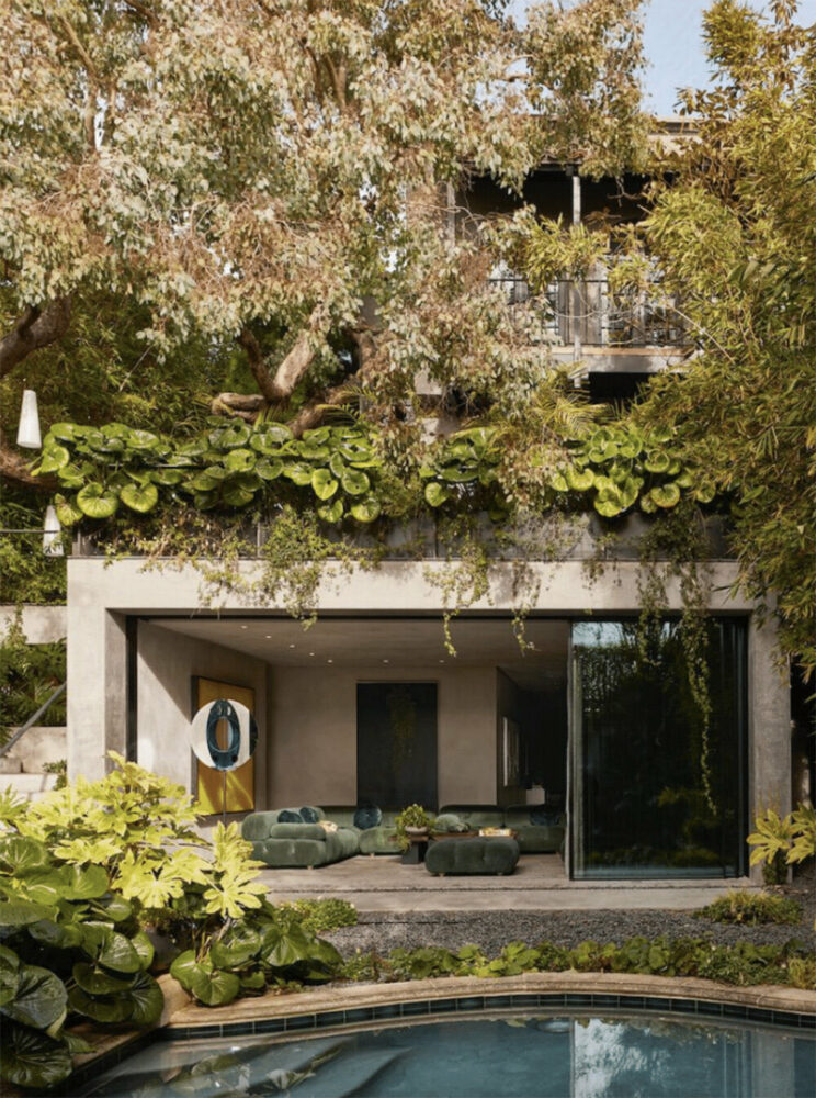 the 1920s house sits on a new concrete plinth