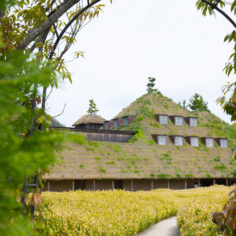 michele de lucchi & terunobu fujimori's grass-veiled la collina echoes its hilly surroundings