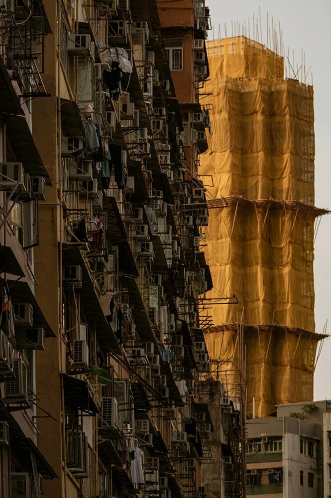 old building against new one in construction in Mong-Kok, Kowloon