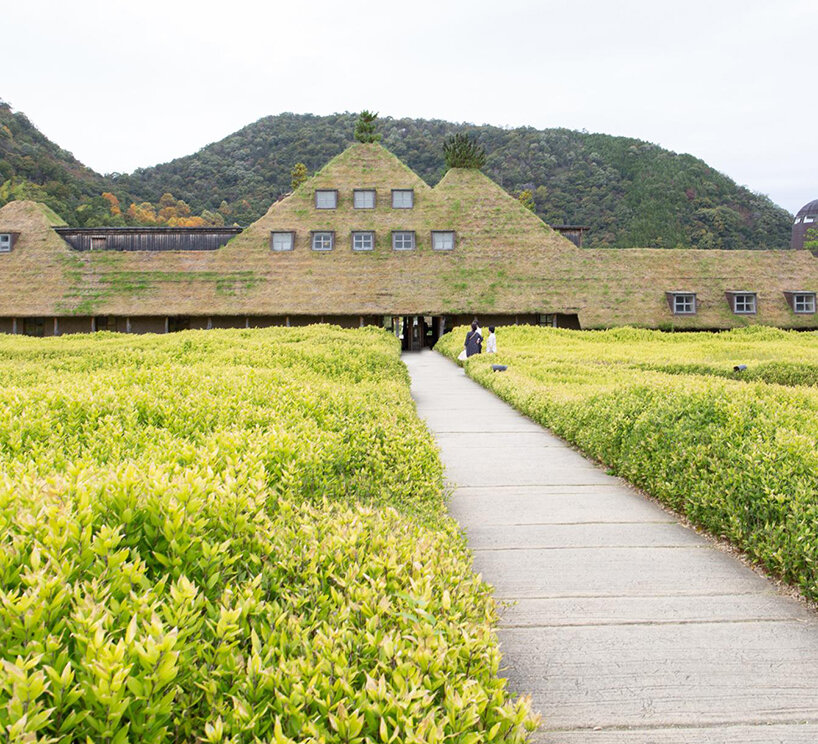 michele de lucchi & terunobu fujimori's grass-veiled la collina echoes its hilly surroundings