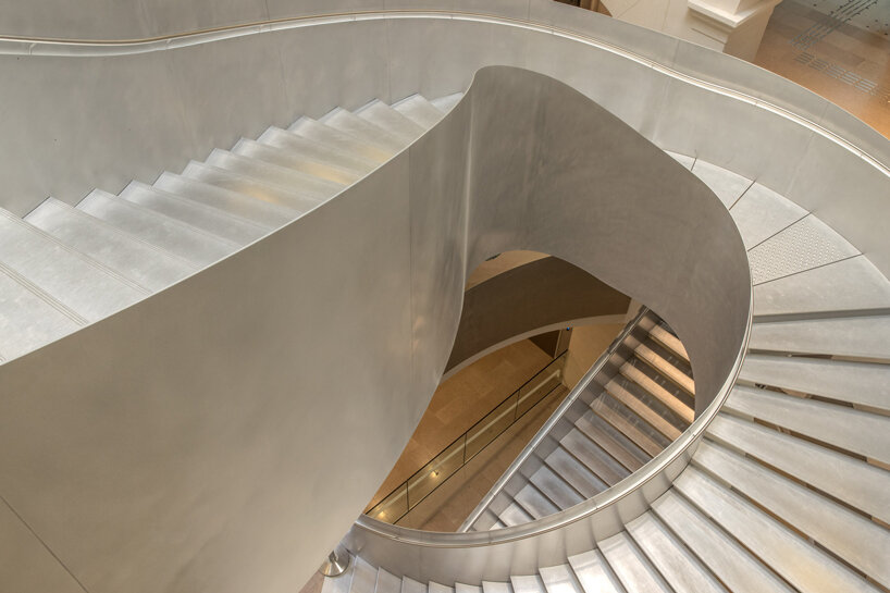 monumental staircase meanders within national library of france, captured by danica o. kus