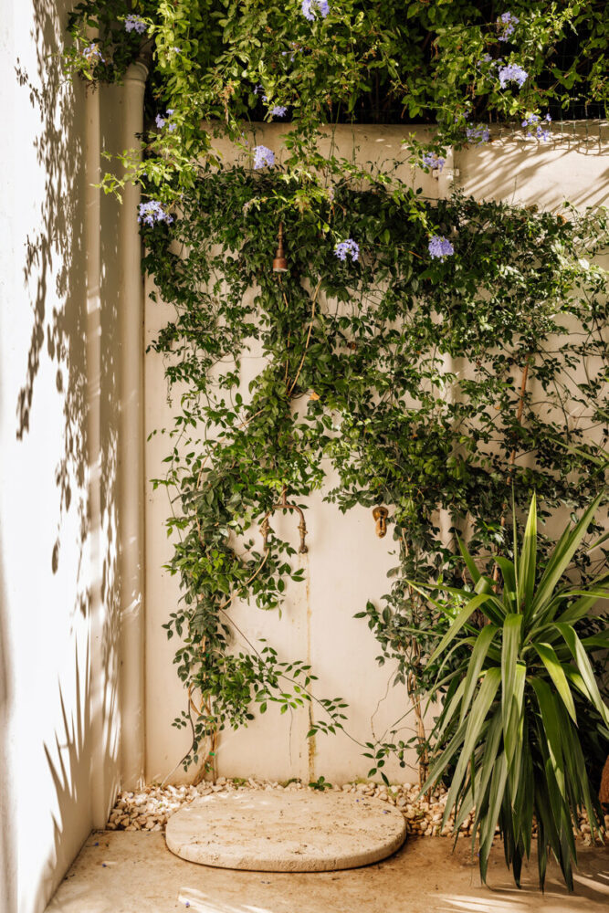 copper outdoor shower and bespoke stone shower base