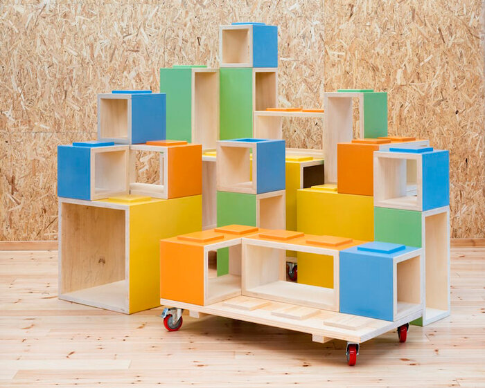 modular furniture pieces assemble to form varying play scenarios within lisbon-based school