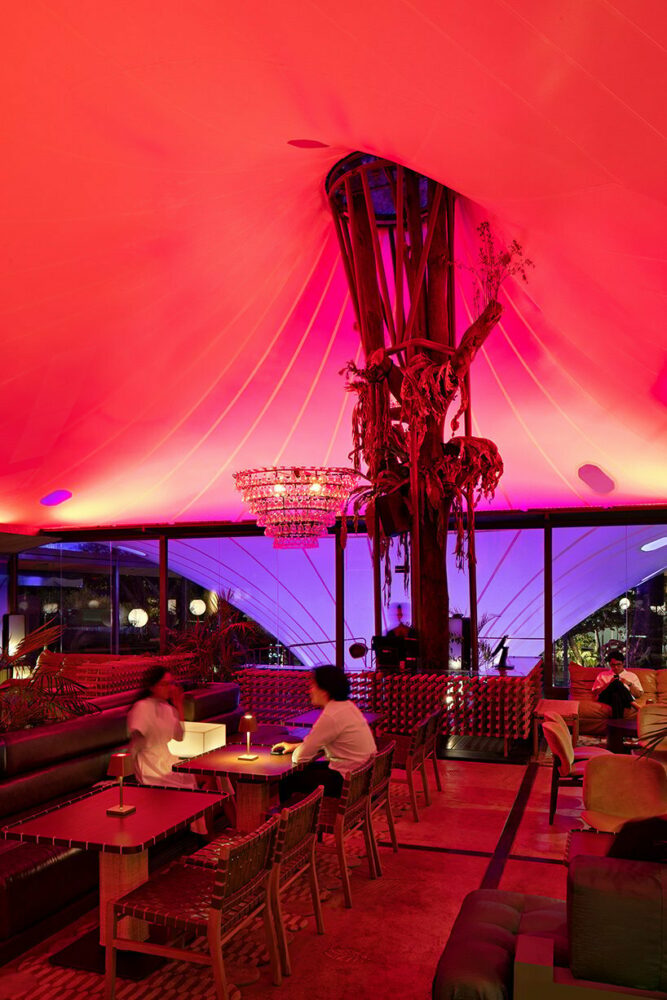 the roof-ceiling acts as a canvas for dynamic and colorful lighting plays