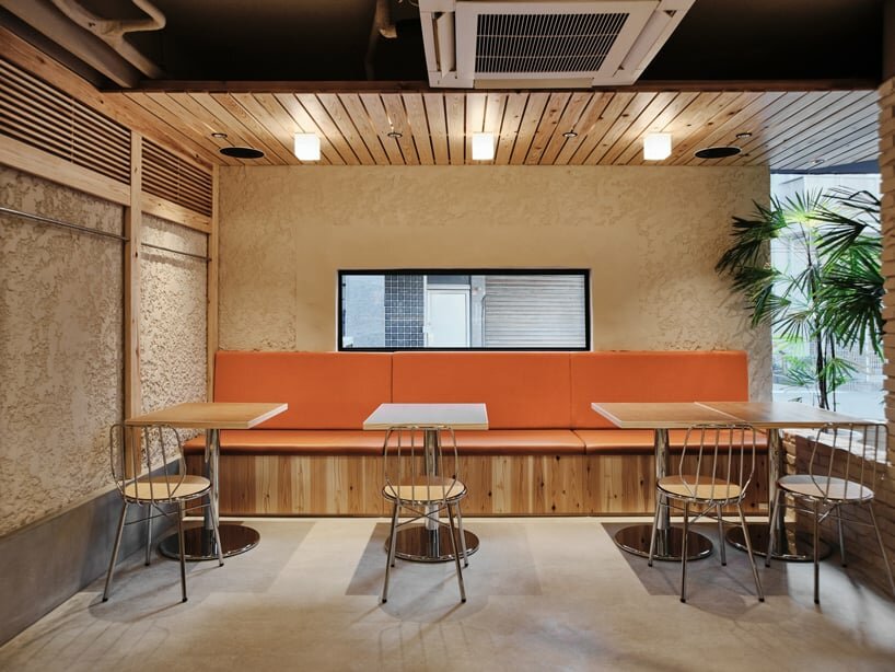 the renovation maintains a harmonious material and color palette