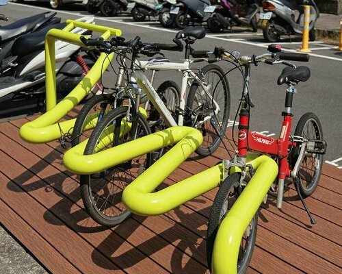 winding tube rack reclaims urban spaces for bike parking and public seating in taipei