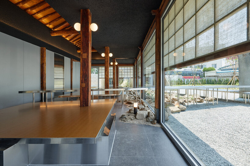 traditional wooden hanok roof frame tops nomal's renovated restaurant in korea - 3