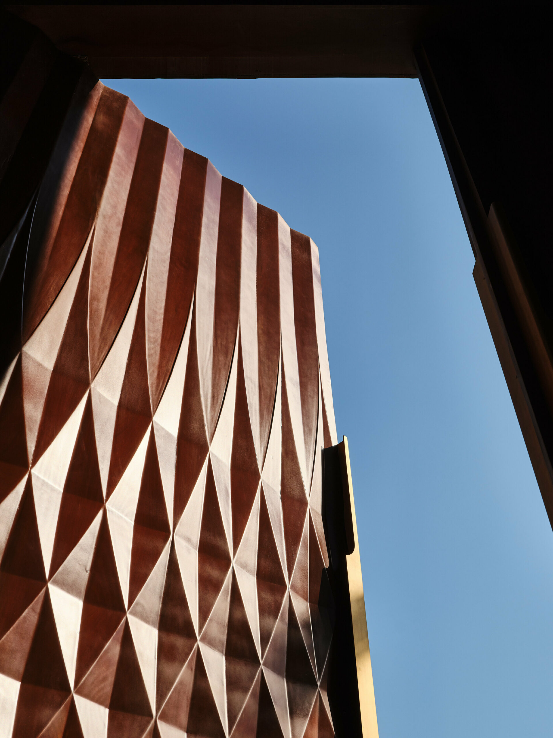 rhythmically stacked, rotating volumes and half domes compose kuwaiti mosque by babnimnim