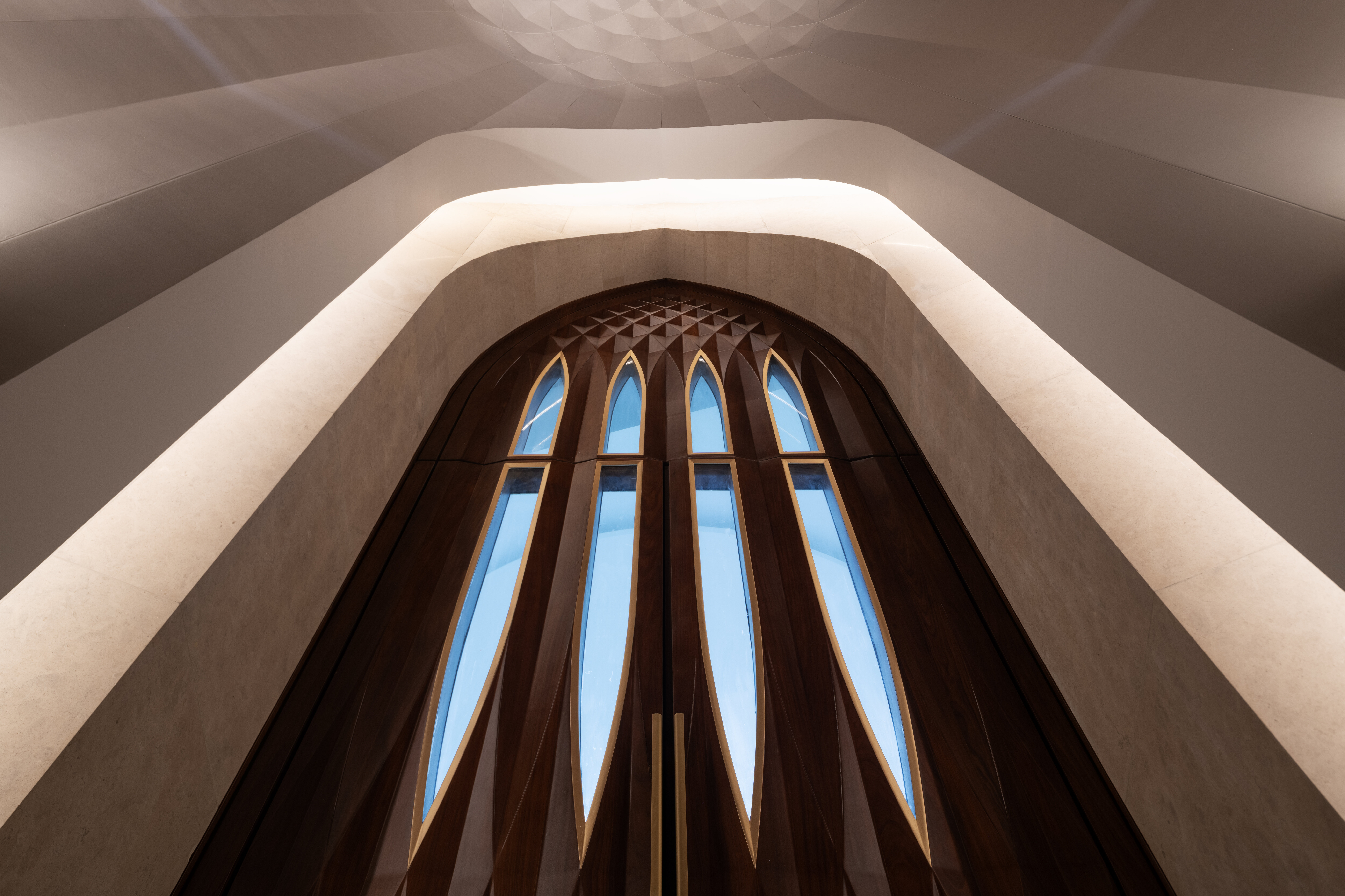 rhythmically stacked, rotating volumes and half domes compose kuwaiti mosque by babnimnim