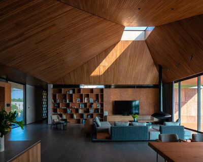wooden pyramid skylight illuminates suoi hai villa's interior in vietnam