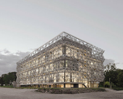 veiled in robotically woven facade, texoversum university building opens in germany