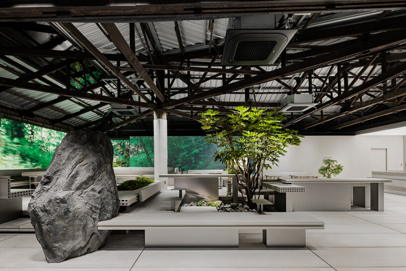 WGNB's beauty store in seoul recreates imaginary island landscape with giant rocks 