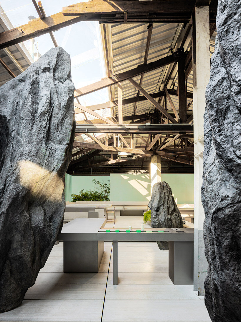 WGNB's beauty store in seoul recreates imaginary island landscape with giant rocks 