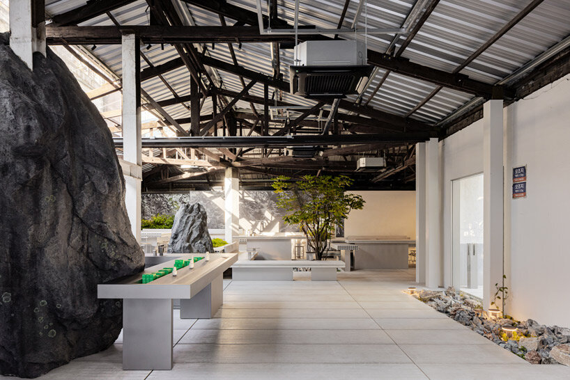 WGNB's beauty store in seoul recreates imaginary island landscape with giant rocks 