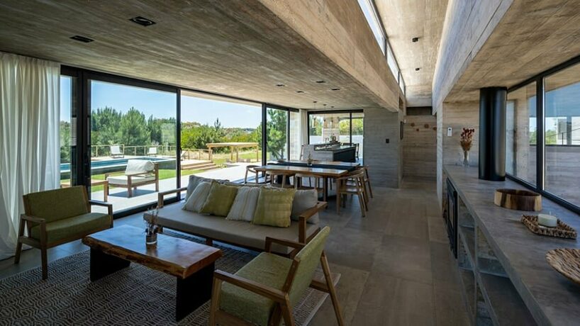 concrete furnishings, including beds and storage, align with the client's preference for uniformity