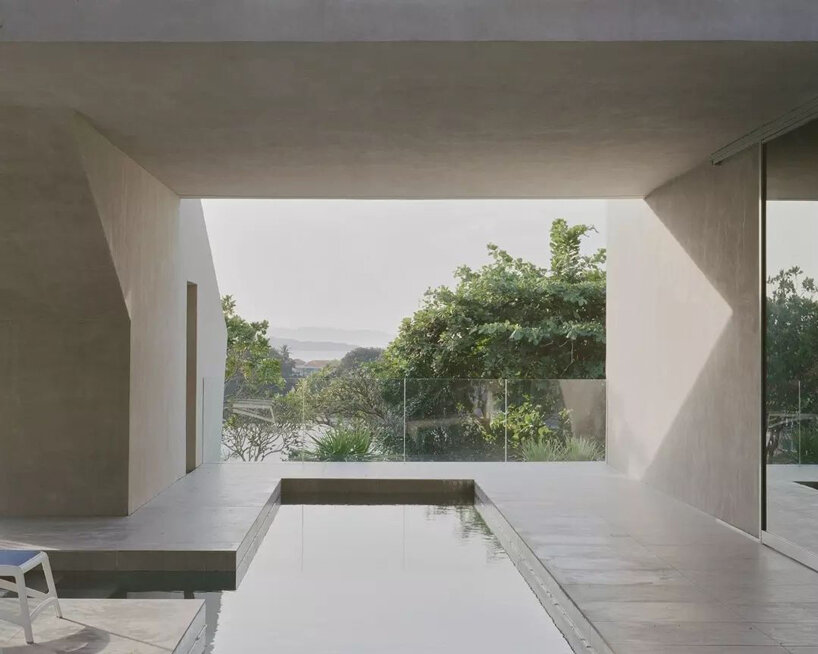 concrete cubes overlooking the ocean and sky compose CAZA's house in the philippines