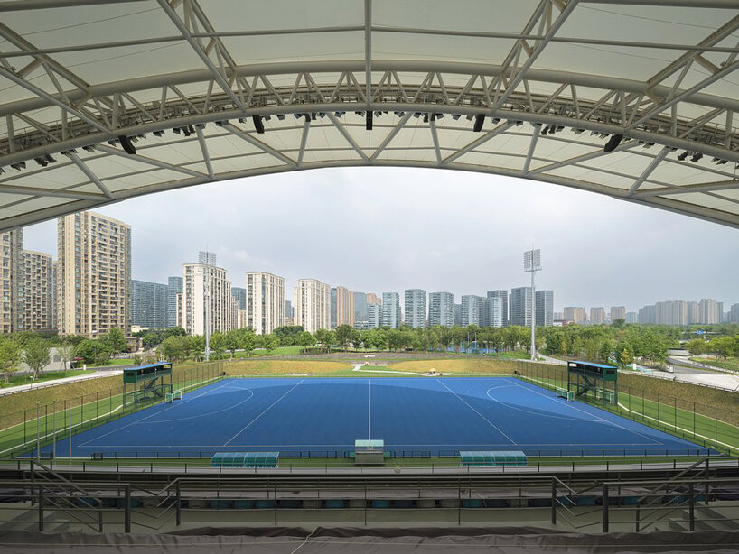 archi-tectonics tops field hockey stadium in hangzhou with 125-meter free-span wing roof