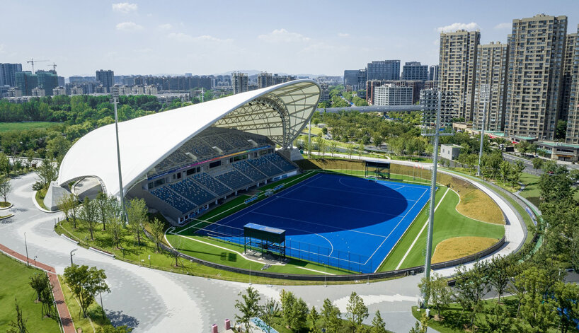 archi-tectonics tops field hockey stadium in hangzhou with 125-meter free-span wing roof