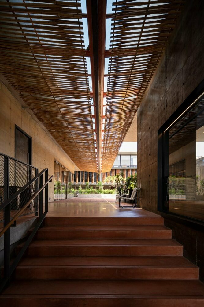 woven bamboo panels, referencing Thai craft, serve as sunscreens along the main walkway to the Garden Plaza
