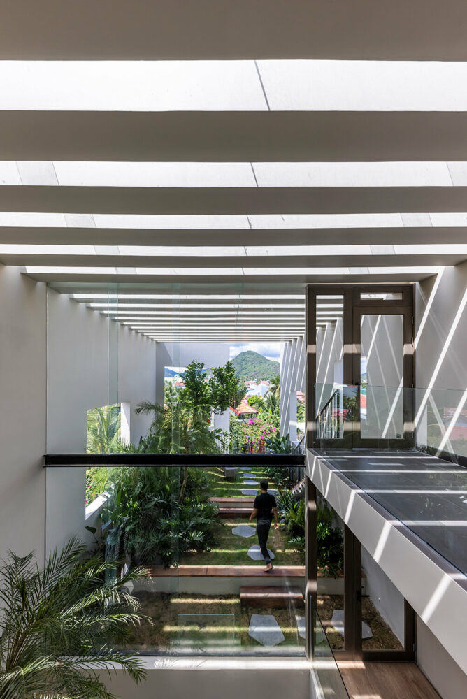 the spaces are interconnected through a staircase and an open void in the middle of the house