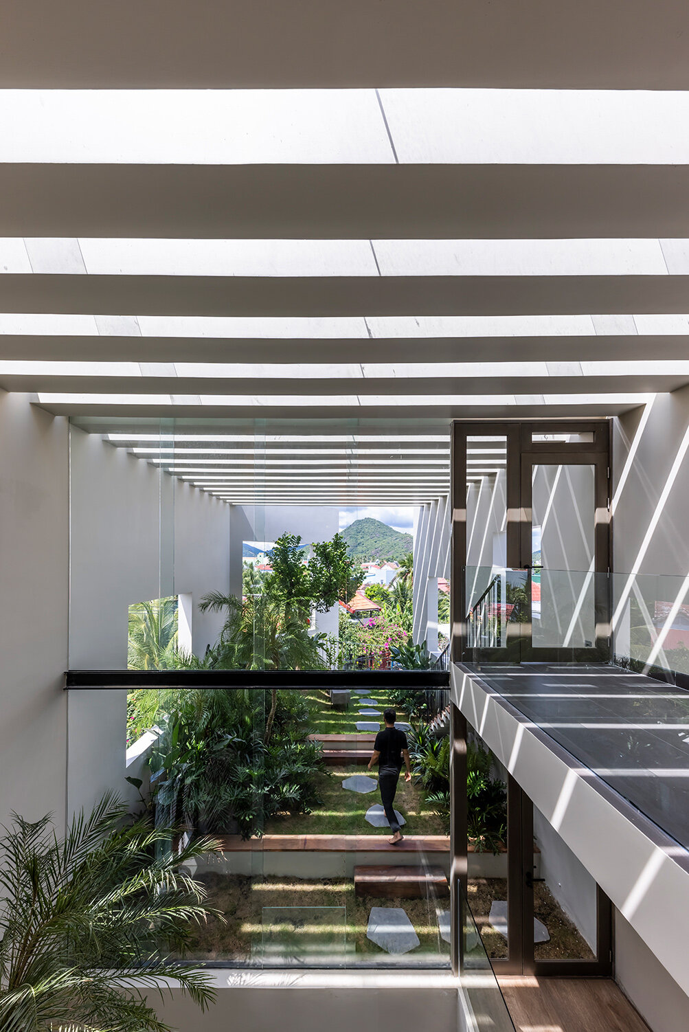 cutout patios bring nature inside pham huu son's skygarden house in