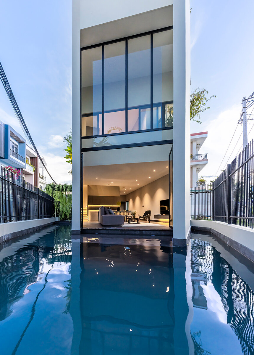 cutout patios bring nature inside pham huu son's skygarden house in