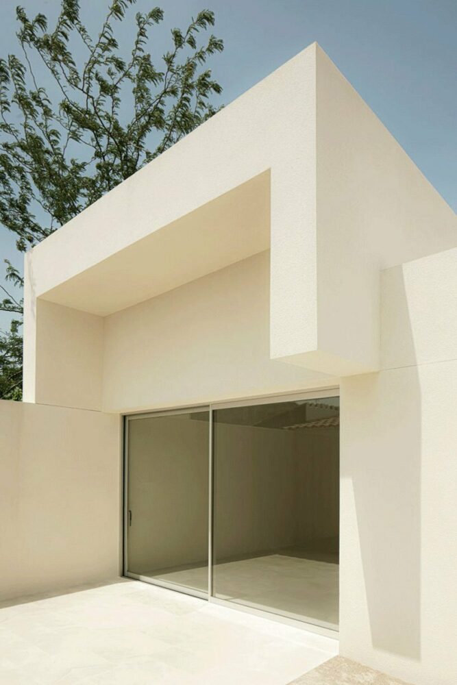 the south-facing courtyard serves as a playground, while the front encourages vegetation growth