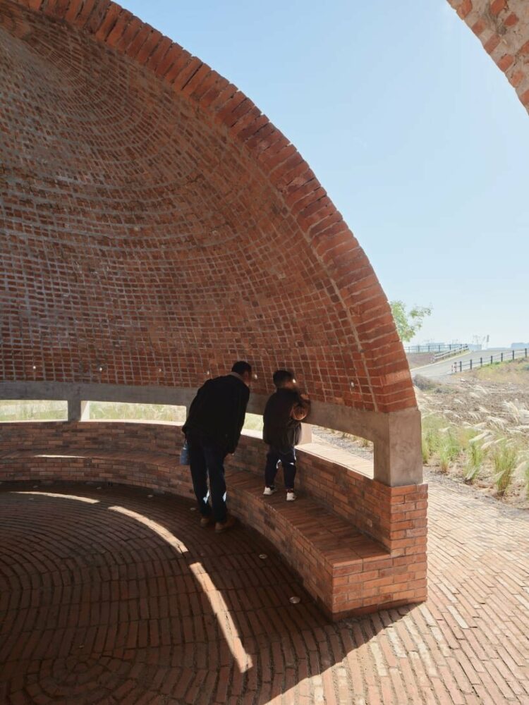 visitors reading through the peepholes