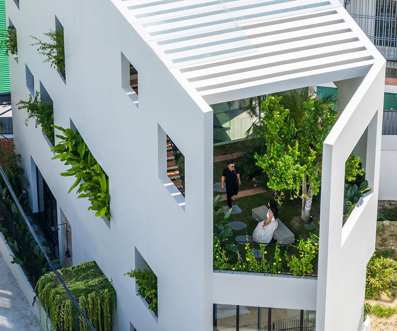 cut-out patios bring nature inside pham huu son's skygarden house in vietnam