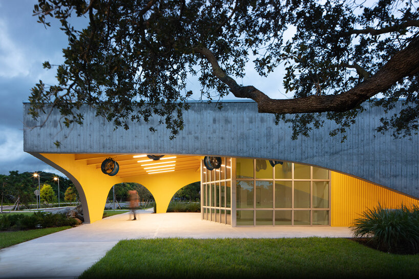 brooks + scarpa sculpts florida pavilion with yellow archways and lattice screen