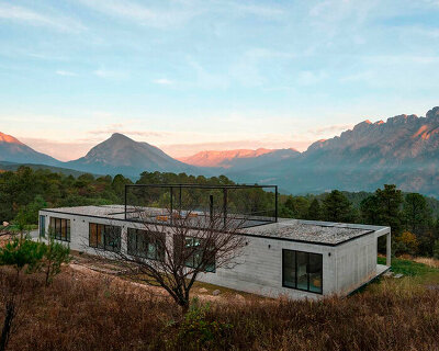 S-AR adorns house's exposed concrete volumes with black metalwork in mexico