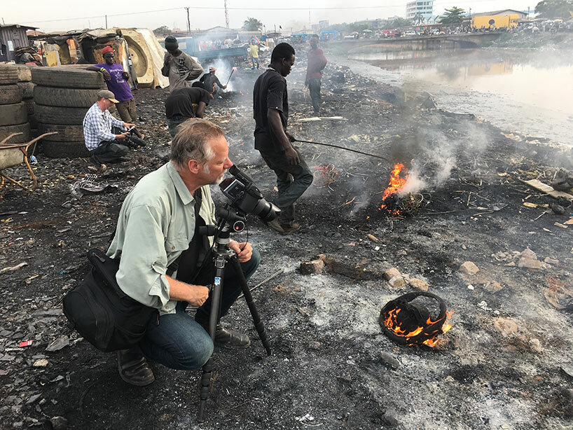 Burtynsky with Jim Panou in Agbogbloshie Recycling Yard, Accra, Ghana, 2017 | photograph by Nathan Otoo, courtesy of the Studio of Edward Burtynsky