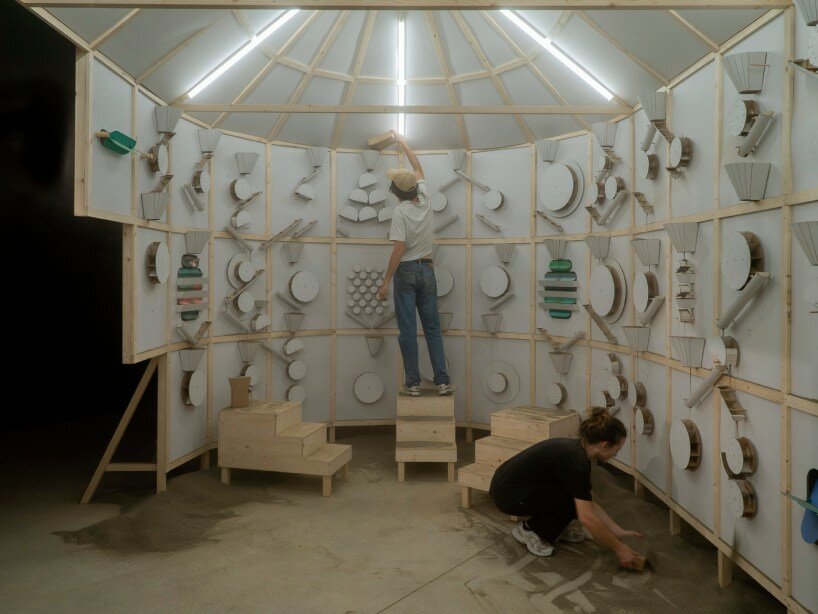 whirring panels animate pinaffo & pluvinage's cardboard installation, powered solely by sand 