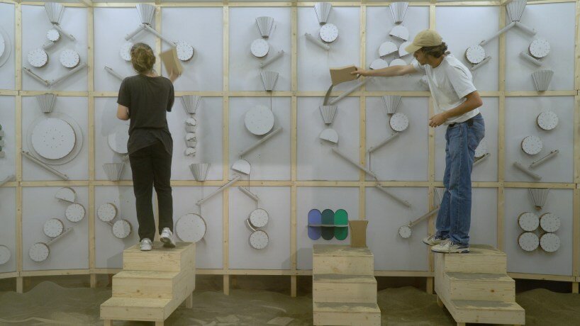 whirring panels animate pinaffo & pluvinage's cardboard installation, powered solely by sand 