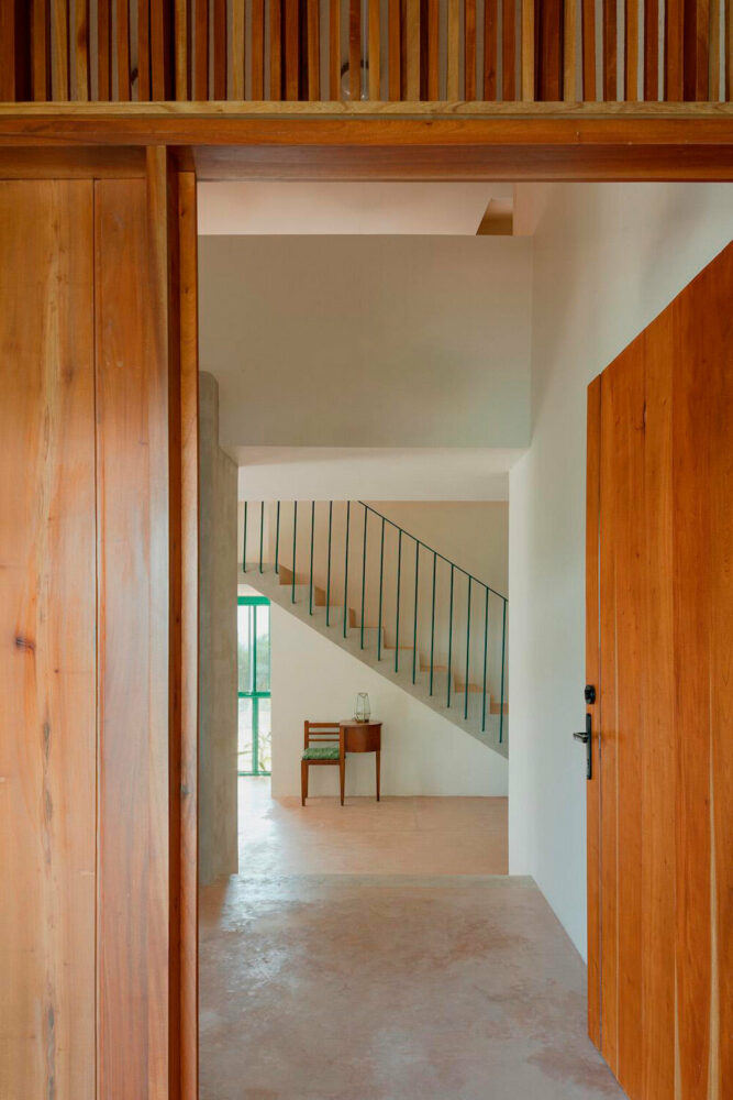 the former foyer serves as a pantry and wine cellar, showcasing the project's thoughtful spatial reconfiguration