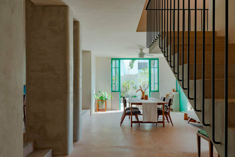 removing a wall beneath the stairs opened up the interior from the foyer through to the rear patio