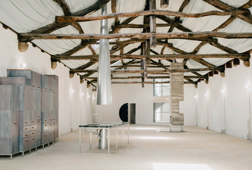 fala atelier transforms former warehouse into 'the house of many faces' in portugal