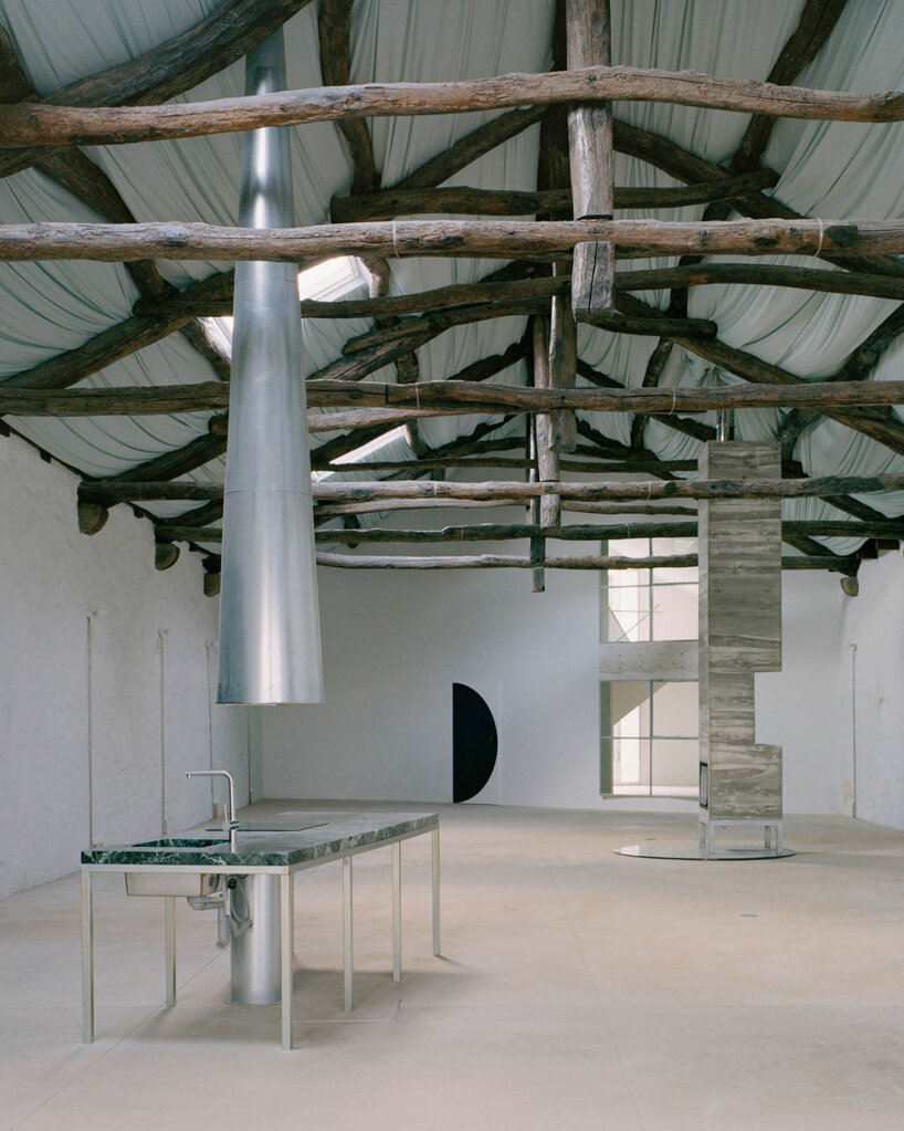 fala atelier transforms former warehouse into 'the house of many faces' in portugal