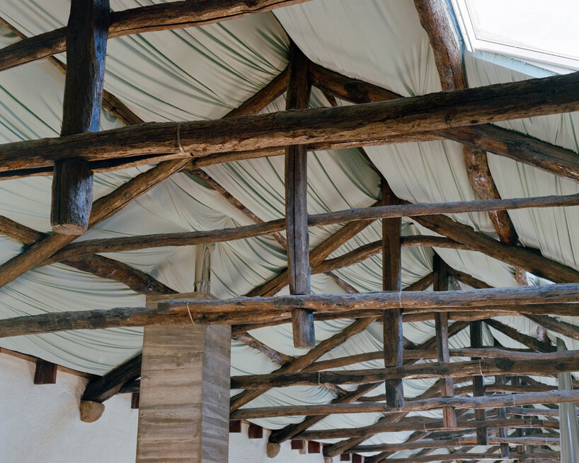 fala atelier transforms former warehouse into 'the house of many faces' in portugal