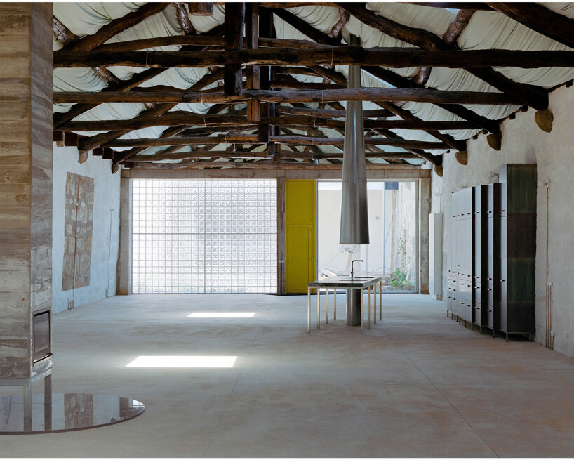 fala atelier transforms former warehouse into 'the house of many faces' in portugal