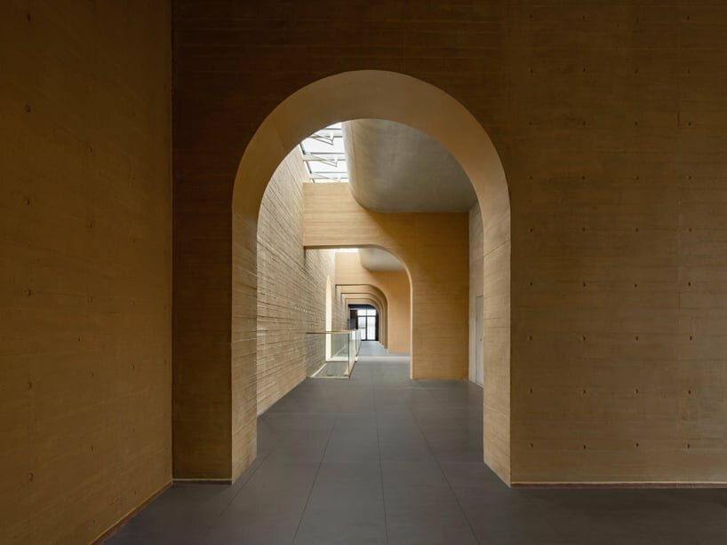 light-guiding openings channel daylight to lower levels, promoting energy efficiency throughout the project