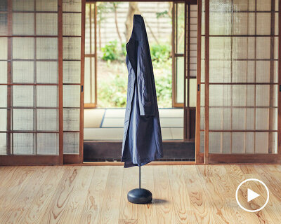 spindle coat rack by koichi futatsumata gently sways when garments are hung on it